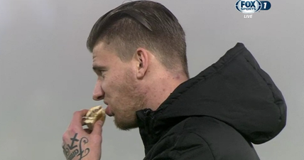 Feyenoord striker punished for eating a burger on the touchline during a game