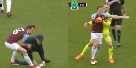 Mark Noble throws West Ham supporter to the ground during pitch invasion