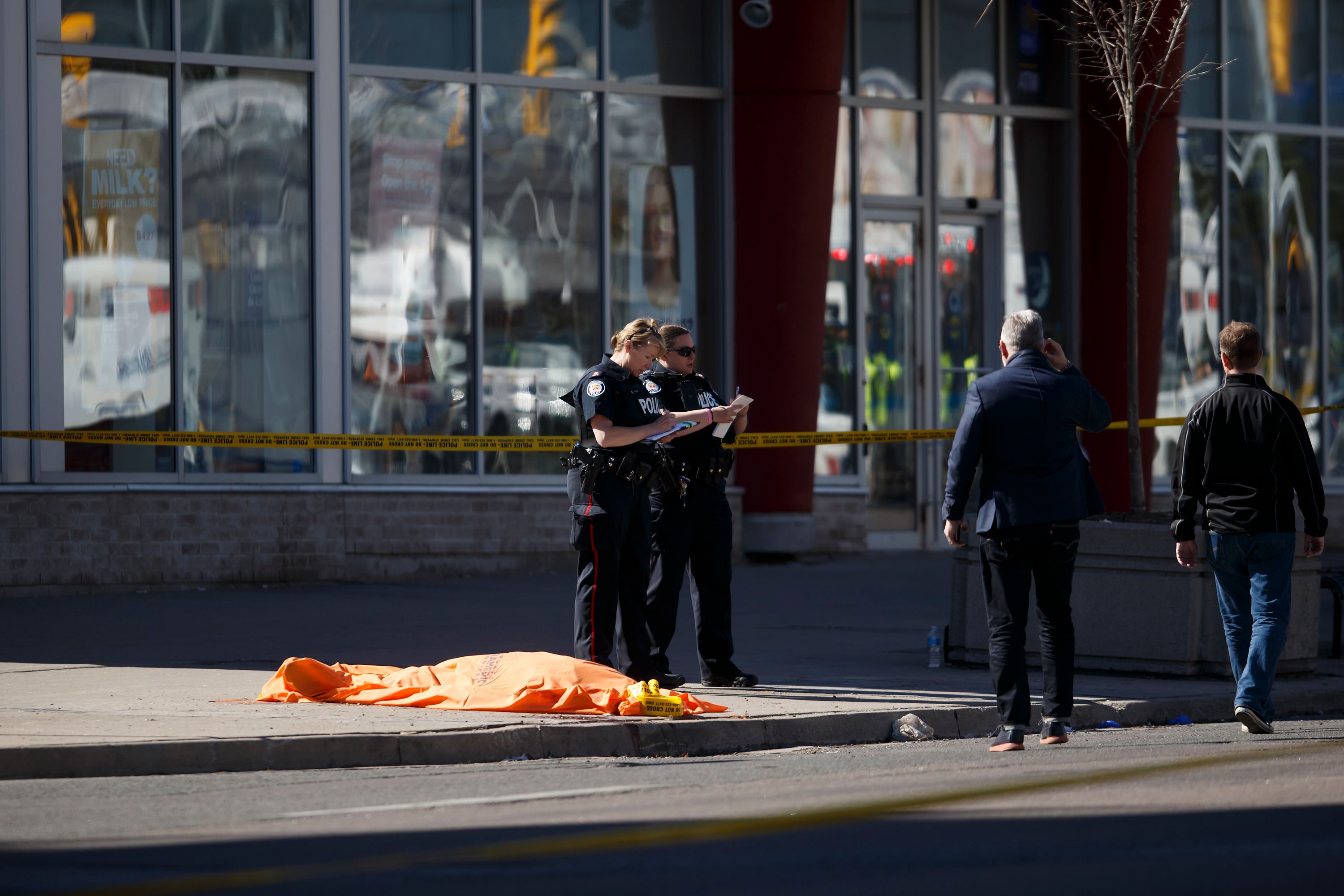 An unidentified body at the scene after a van plowed into pedestrians on April 23, 2018
