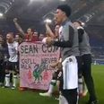 Liverpool players celebrate with Sean Cox banner after Roma match