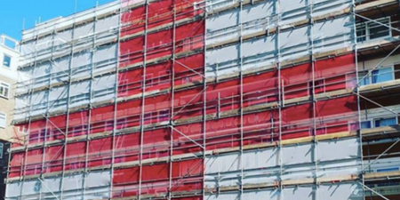 Scaffolders cover eight-storey block of flats with gigantic England flag