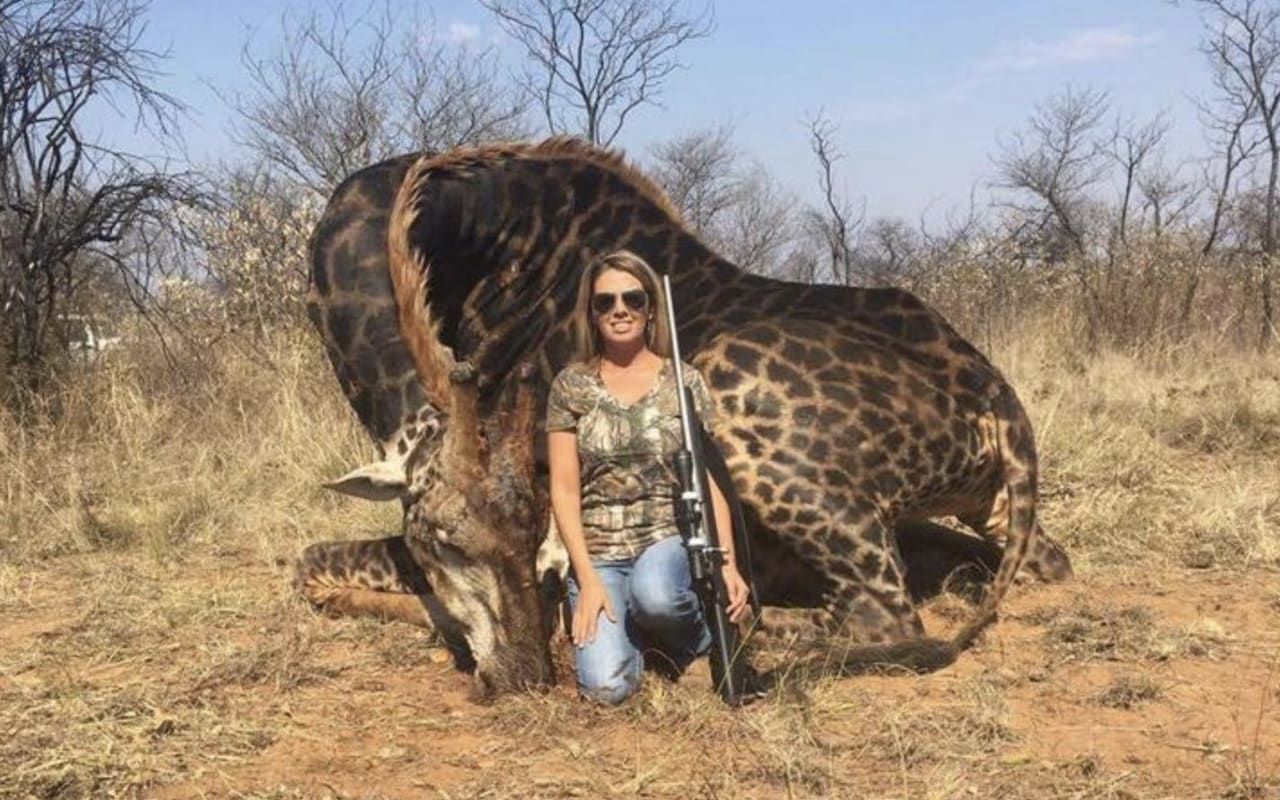 Tess Thompson Talley poses with a rare black giraffe she hunted