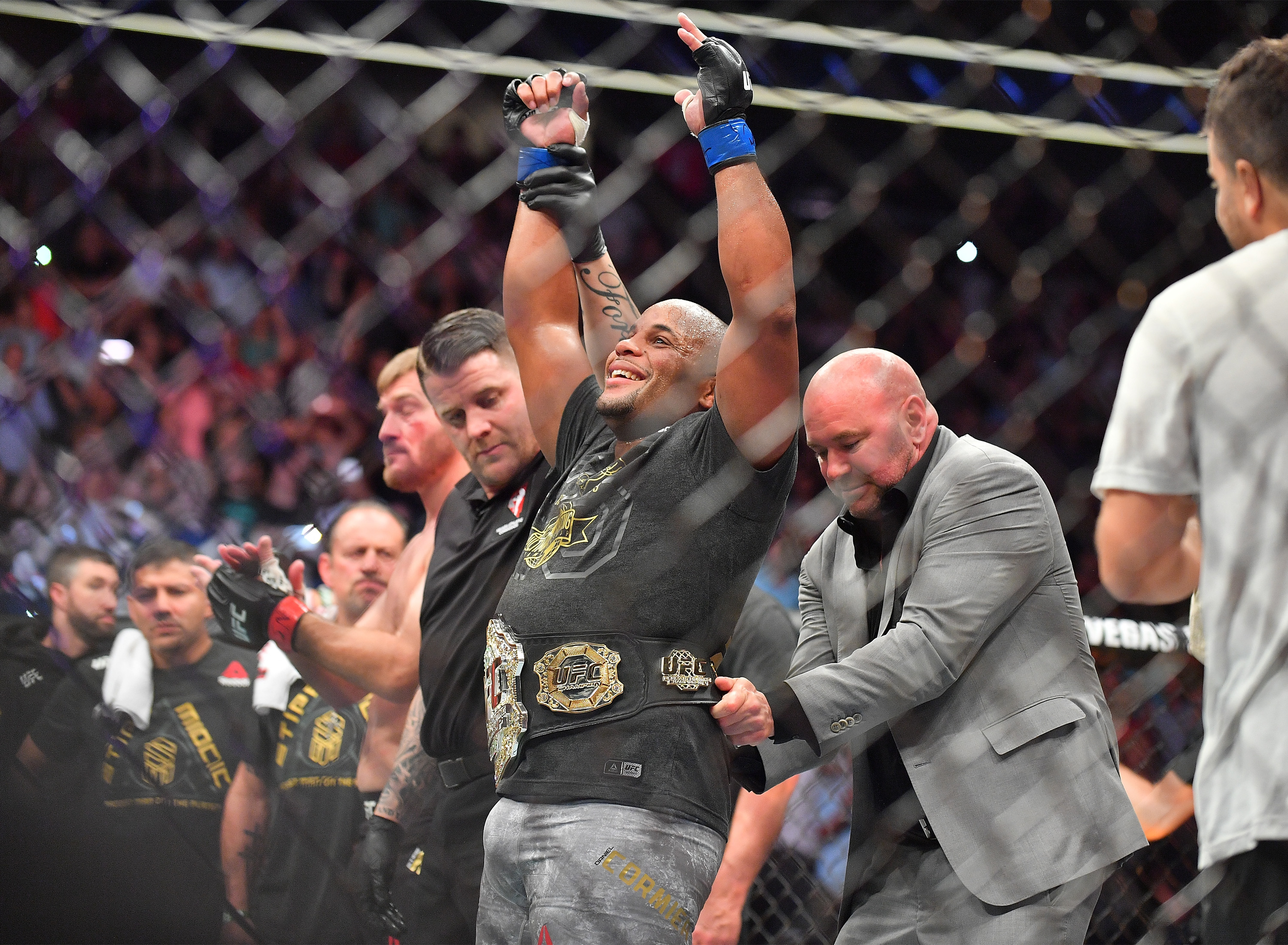 LAS VEGAS, NV - JULY 07: UFC President Dana White (R) places the championship belt around the waist of Daniel Cormier after he defeated Stipe Miocic in their heavyweight championship fight at T-Mobile Arena on July 7, 2018 in Las Vegas, Nevada. Cormier won by first round knockout. (Photo by