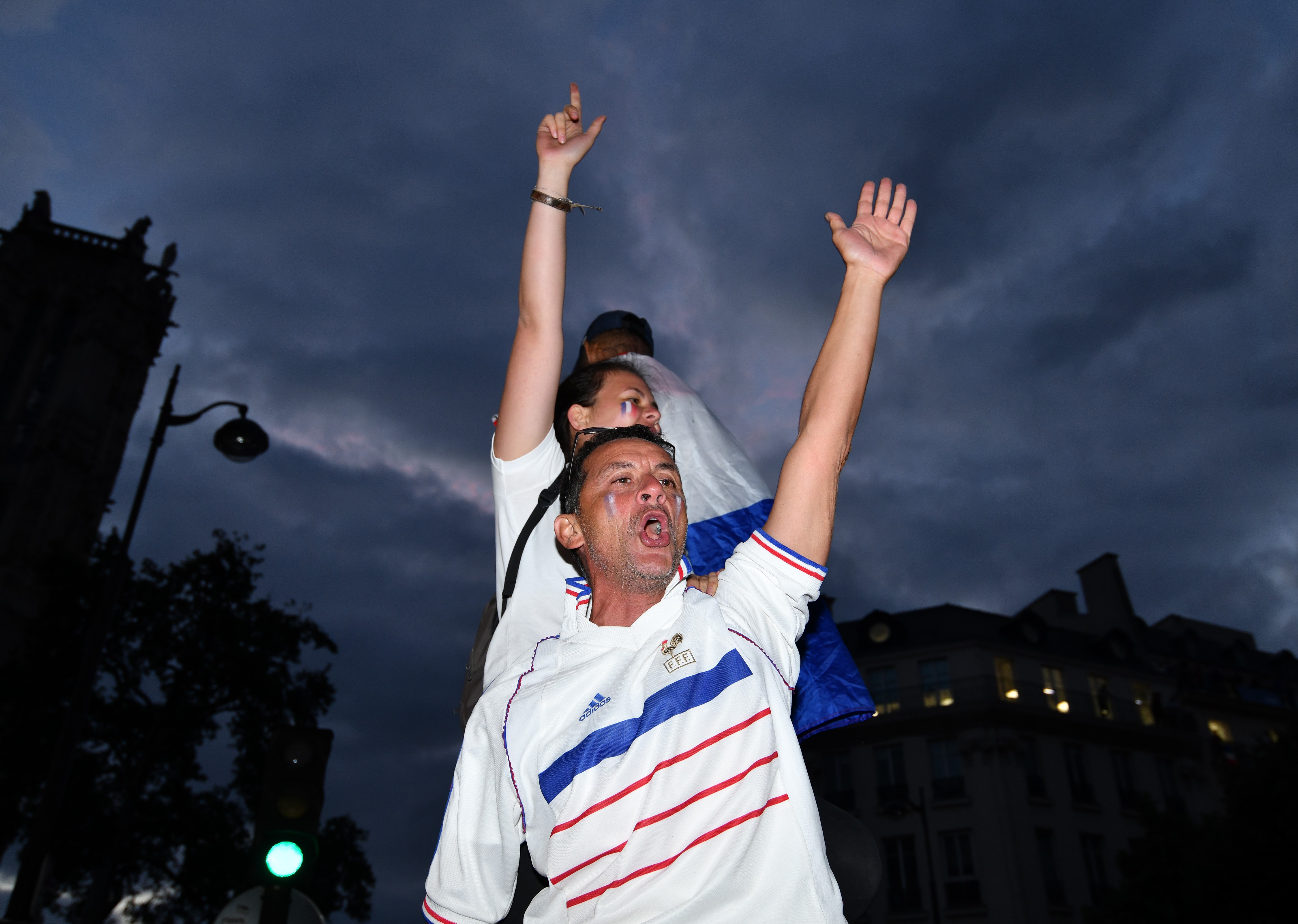 PARIS, FRANCE - JULY 10: Supporters of France football national team celebrate their team's victory against Belgium of the semifinal match in the FIFA 2018 World Cup in Paris, France on July 10, 2018. (Photo by Mustafa Yalcin/Anadolu Agency/Getty Images)