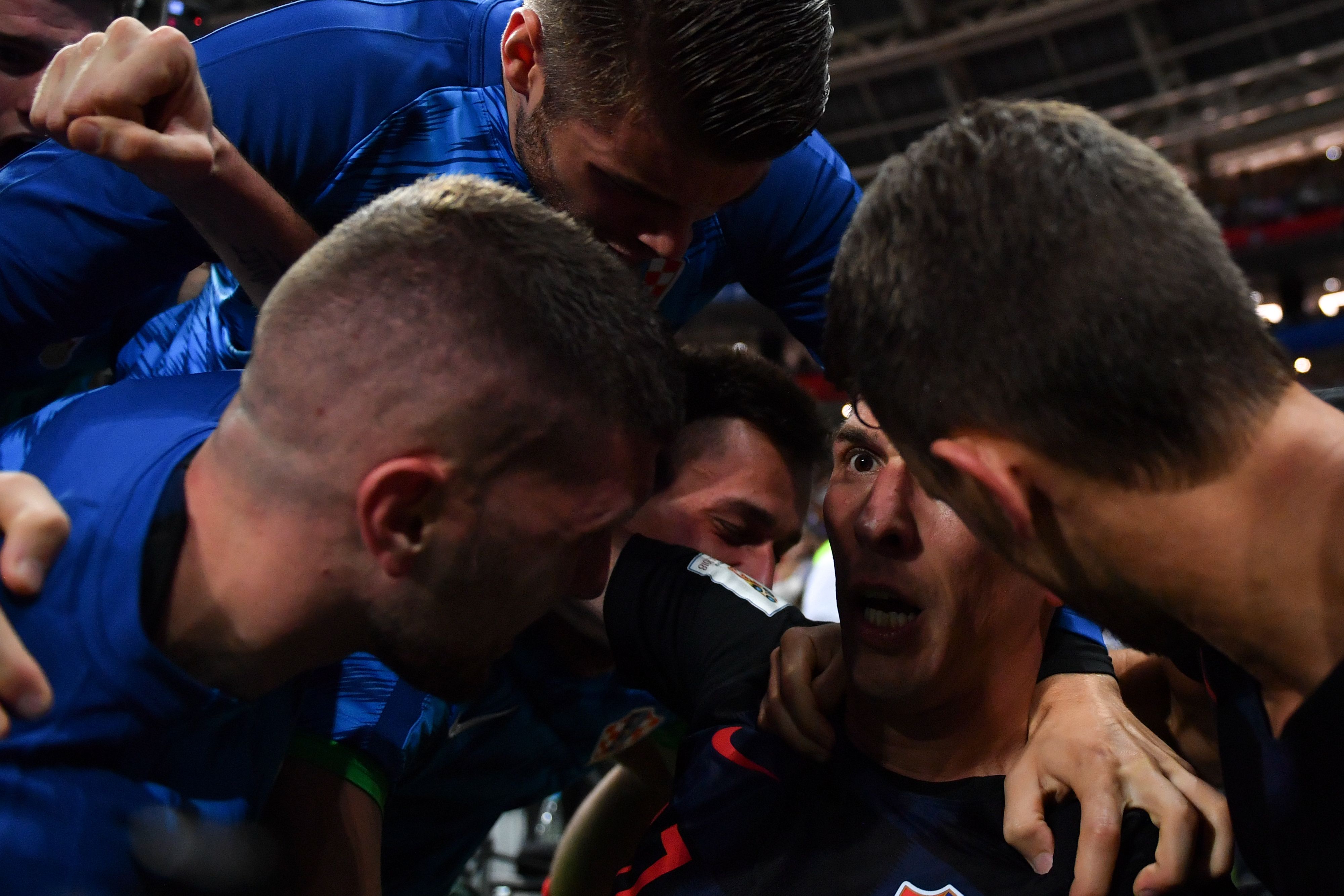 TOPSHOT - Croatia's forward Mario Mandzukic (C) celebrates with teammates after scoring his team's second goal during the Russia 2018 World Cup semi-final football match between Croatia and England at the Luzhniki Stadium in Moscow on July 11, 2018.