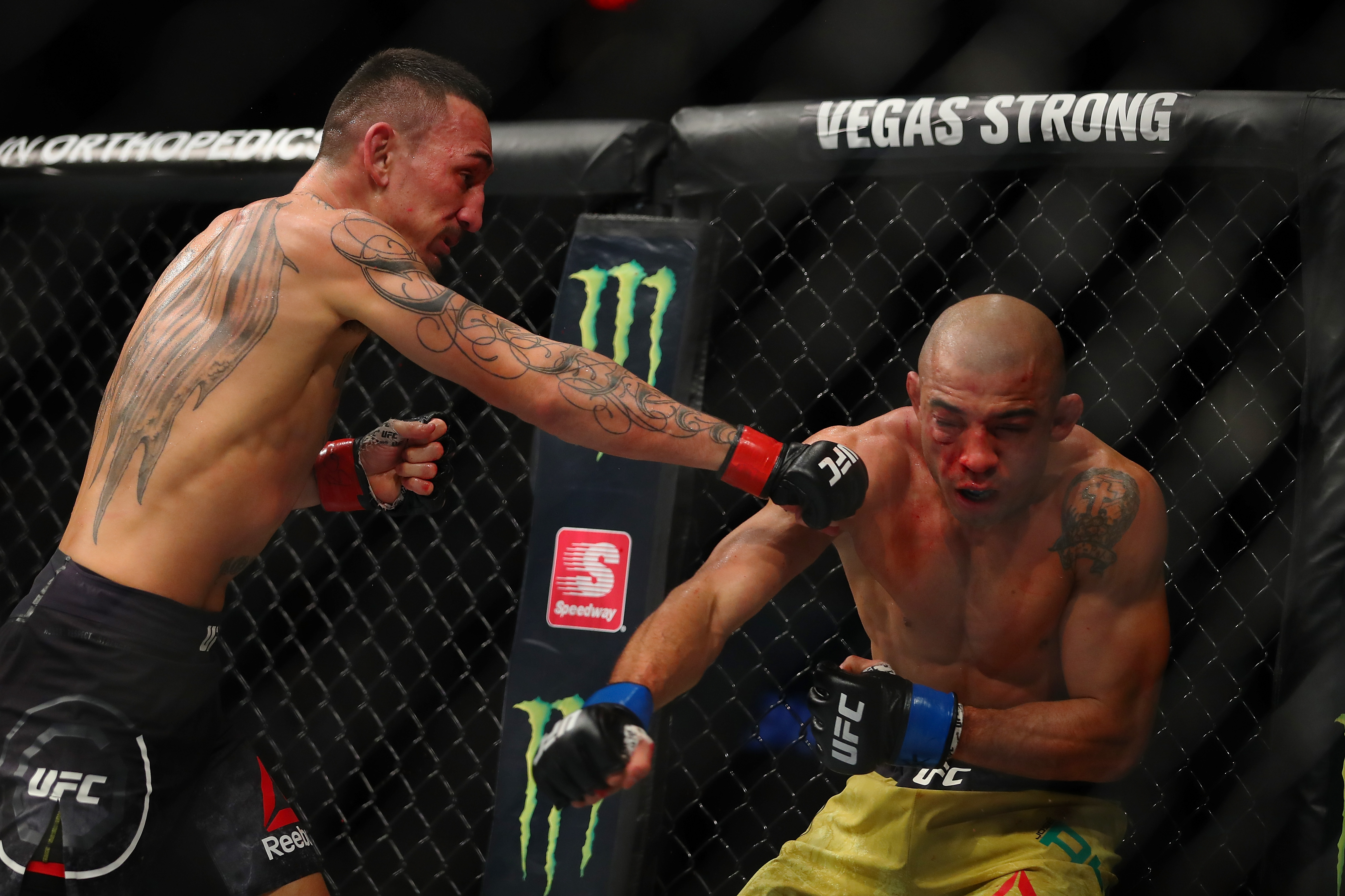 7DETROIT, MI - DECEMBER 02: Max Holloway (L) battles  Jose Aldo of Brazil (R) during UFC 218 at Little Caesars Arena on December 2, 2018 in Detroit, Michigan. (Photo by Gregory Shamus/Getty Images)
