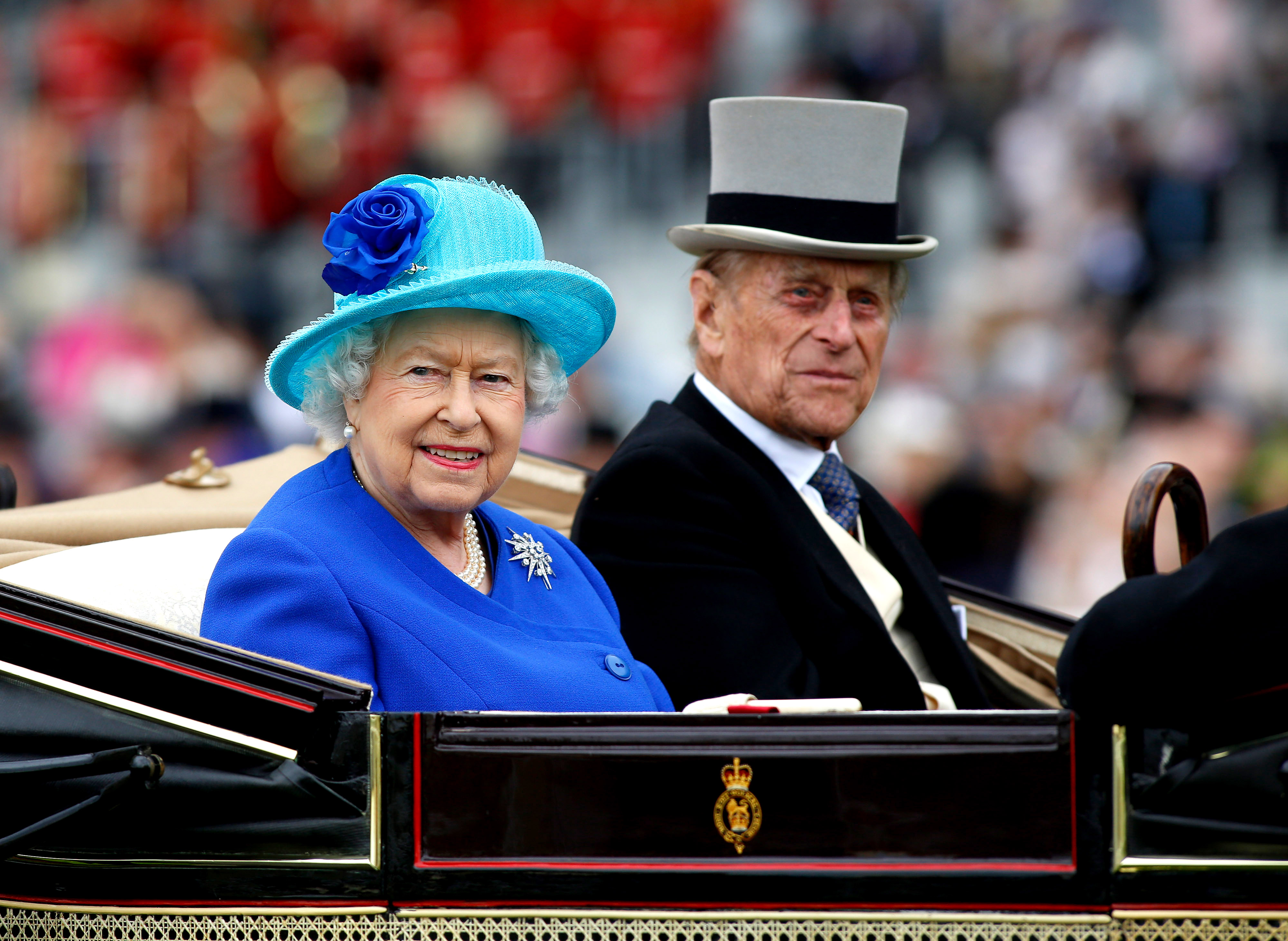 ASCOT, ENGLAND - JUNE 18: Queen Elizabeth II and Prince Philip, Duke of Edinburgh take part in the carriage procession during Day Five of Royal Ascot at Ascot Racecourse on June 18, 2016 in Ascot, England. (Photo by Julian Herbert/Getty Images)