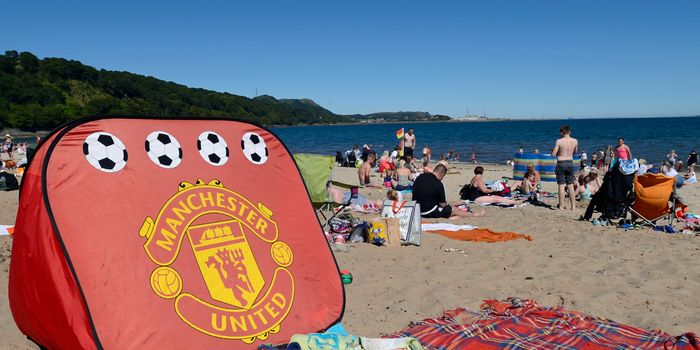 ABERDOUR, SCOTLAND - JULY 03: A Manchester United beach tent on Silver Sands beach as people enjoy the sun at the start of the Scottish school holidays as the heatwave continues, on July 3, 2018 in Aberdour, Scotland. (Photo by Ken Jack - Corbis/Corbis via Getty Images)