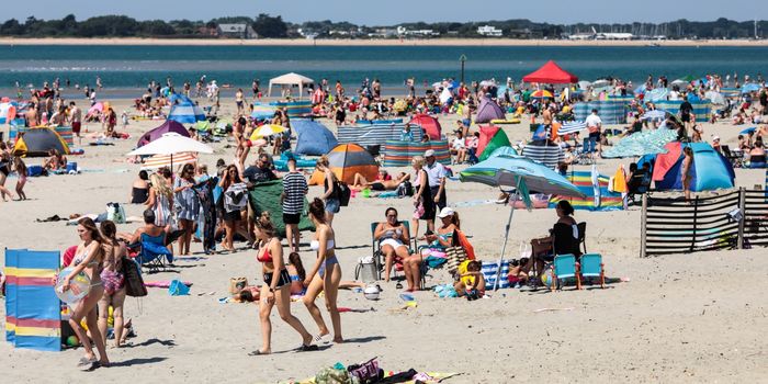 CHICHESTER, ENGLAND - JULY 23: Beachgoers gather on West Wittering Beach during hot weather on the first day of the Summer school holidays on July 23, 2018 in Chichester, England. Today has been the hottest day of 2018 with temperatures rising to 33.3 degrees celsius in some areas. The Met Office have issued an amber weather warning to stay out of the sun between now and Friday as temperatures could continue to rise to 35 degrees celsius. (Photo by Jack Taylor/Getty Images)