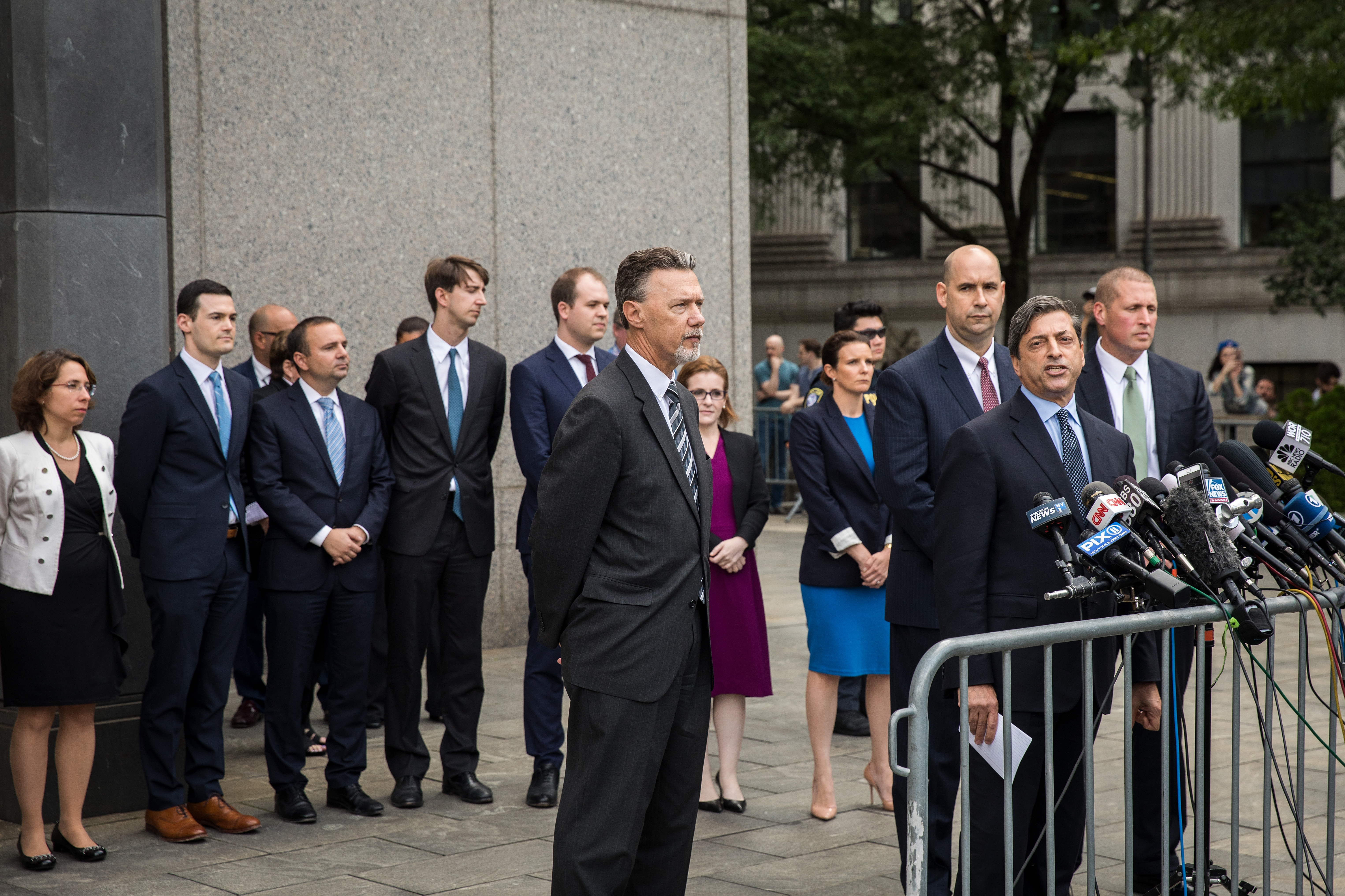 NEW YORK, NY - AUGUST 21: Surrounded by his team of lawyers, Deputy U.S. Attorney for the Southern District of New York Robert Khuzami speaks to the media about the Michael Cohen case outside of federal court, August 21, 2018 in New York City. Cohen reached a plea agreement with prosecutors involving charges of bank fraud, tax fraud and campaign finance violations. (Photo by Drew Angerer/Getty Images)