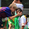Barcelona youngsters console distraught opposition after tournament win