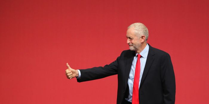 LIVERPOOL, ENGLAND - SEPTEMBER 24: Jeremy Corbyn MP gives the thumbs up to supporters after being announced as the leader of the Labour Party on the eve of the party's annual conference at the ACC on September 24, 2016 in Liverpool, England. The leadership battle between Jeremy Corbyn and MP for Pontypridd Owen Smith, was triggered by Labour MPs who were unhappy with Mr Corbyn's leadership in the run up to the Brexit referendum. (Photo by Christopher Furlong/Getty Images)