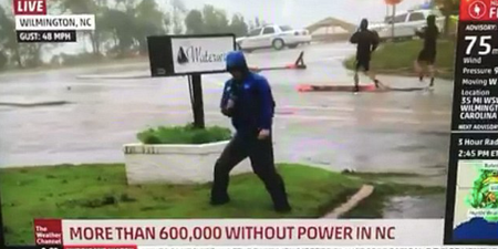 Weatherman called out for being ‘dramatic’ when men casually stroll past during Hurricane broadcast