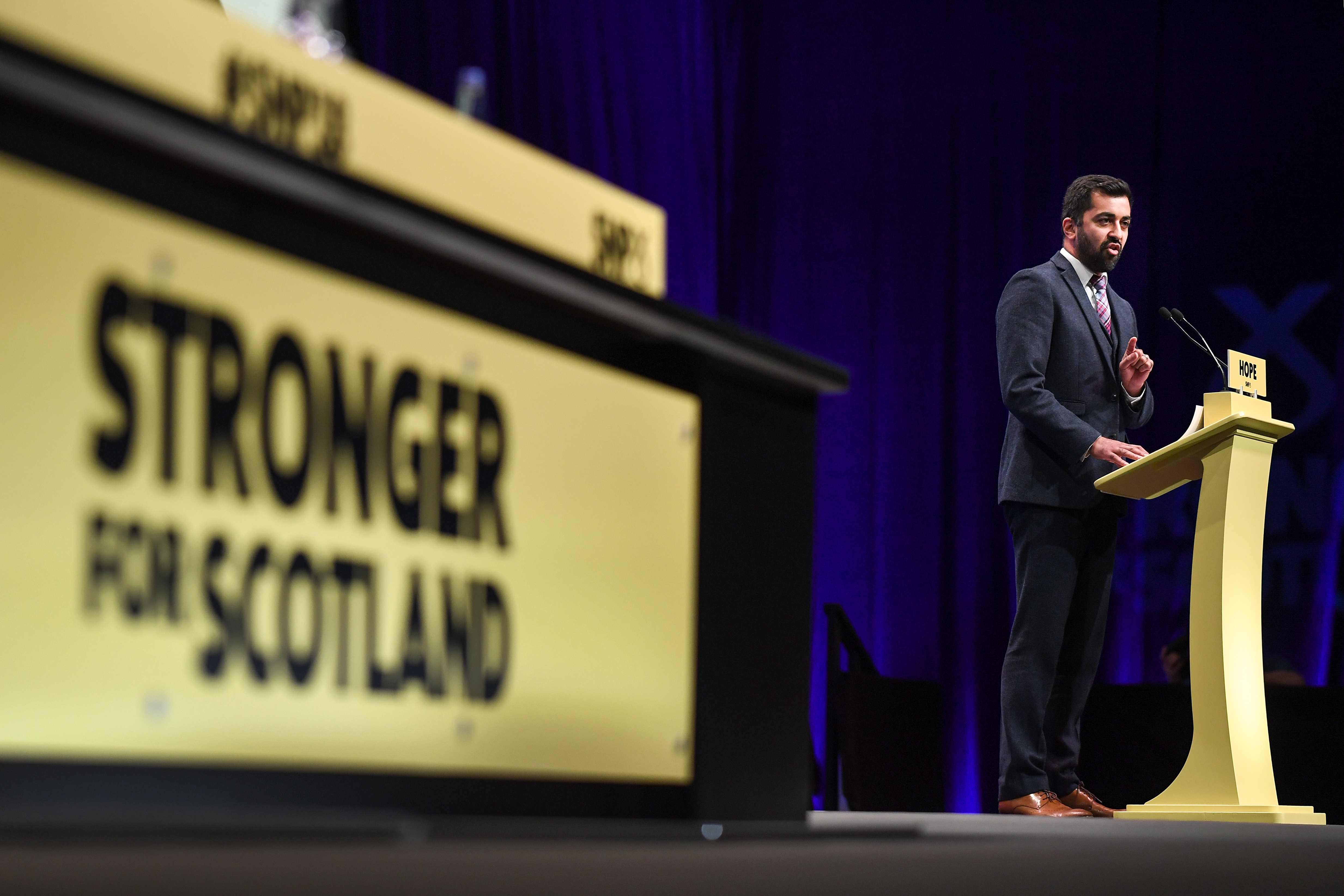 GLASGOW, SCOTLAND - OCTOBER 07: Humza Yousaf MSP, Cabinet Secretary for Justice, makes his keynote speech at the 84th annual SNP conference at the Scottish Exhibition and Conference Centre on October 7, 2018 in Glasgow, Scotland. Members will gather in Glasgow for the three day conference which will conclude on Tuesday with a keynote speech by the party leader. (Photo by Jeff J Mitchell/Getty Images)