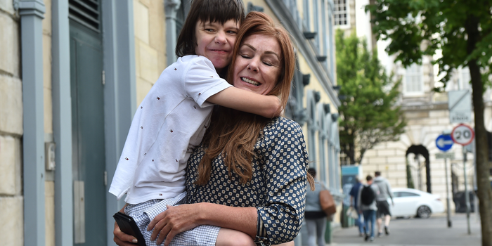 BELFAST, NORTHERN IRELAND - JULY 05: Billy Caldwell and his mother Charlotte react with one another as they return to Belfast on July 5, 2018 in Belfast, Northern Ireland. Billy Caldwell who is severely epileptic had been receiving treatment in London for his condition and had been denied the use of cannabis oil to help his condition. On Tuesday the government said it would reach a decision within the next few weeks on whether laws around medicinal cannabis would be changed. (Photo by Charles McQuillan/Getty Images)