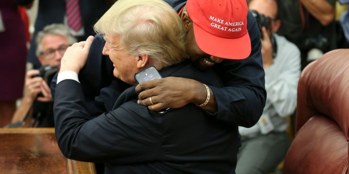 WASHINGTON, DC - OCTOBER 11: (AFP OUT) U.S. President Donald Trump hugs rapper Kanye West during a meeting in the Oval office of the White House on October 11, 2018 in Washington, DC. (Photo by Oliver Contreras - Pool/Getty Images)