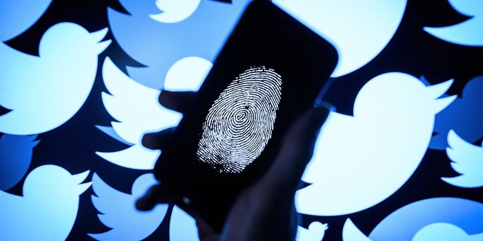 LONDON, ENGLAND - AUGUST 09: In this photo illustration, a thumbprint is displayed on a mobile phone as the logo for the Twitter social media network is projected onto a screen on August 09, 2017 in London, England. With around 328 million users worldwide, Twitter has gone from a small start-up in for the public 2006 to a broadcast tool of politicians and corporations in 2017. (Photo by Leon Neal/Getty Images)