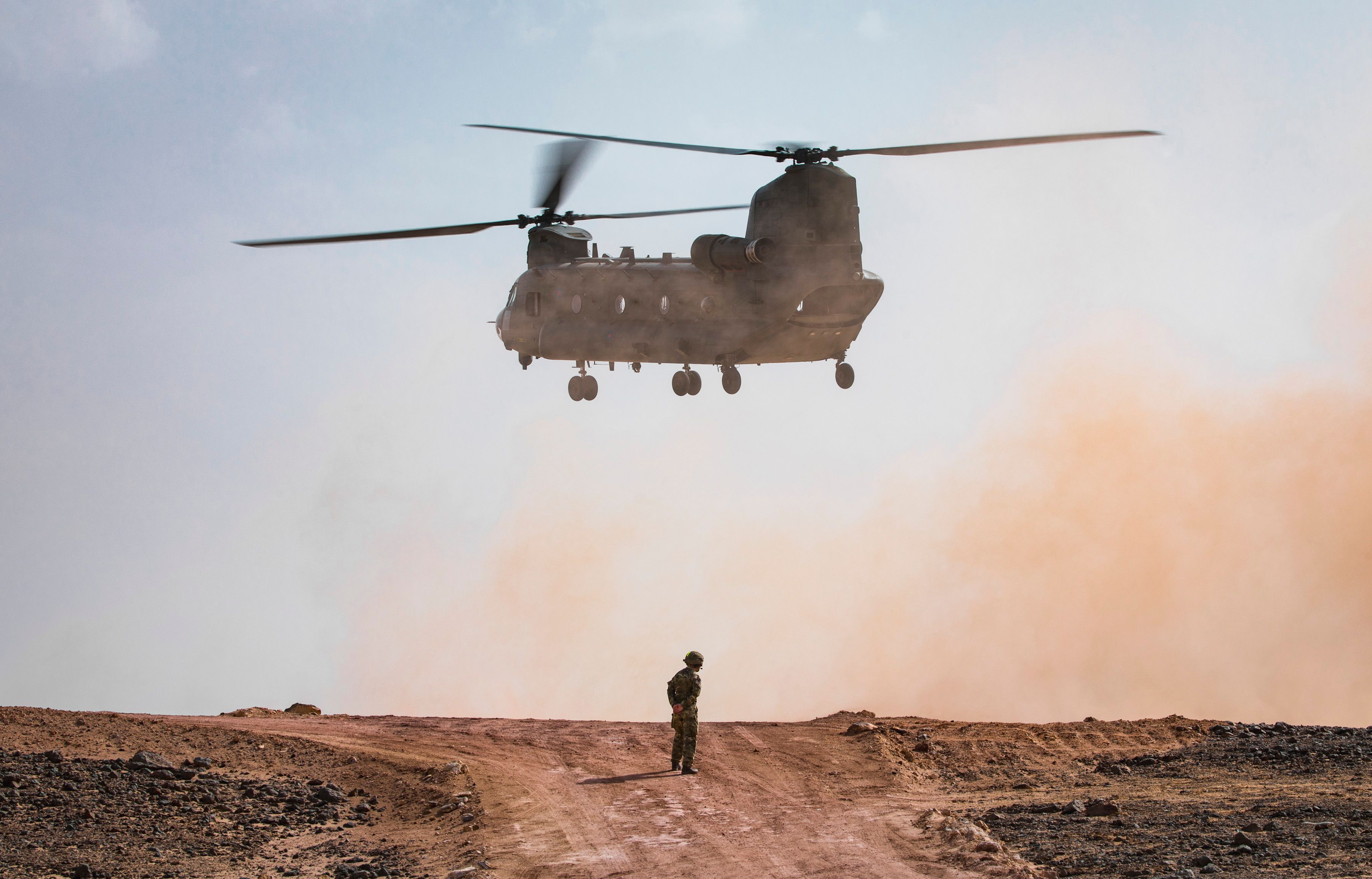 Pictured: A No. 27 Squadron RAF Chinook helicopter lands at the Fire Power Demonstration Area in order to collect the VVIPs and VIPs. British and Omani Militaries combined forces over the last few weeks on Exercise Saif Sareea 3, culminating in an awesome fire power demonstration lasting more than 30 minutes at two separate locations in Oman. On 3 Nov 18 a Fire Power Demonstration brought weeks of hard work together in a series of simulated attacks on targets. Streamed live to a VIP area in an inland location, an amphibious assault by Royal Marines and Omani troops onto a beach location in Eastern Oman with fast-roping from RAF Chinook helicopters of 27 Squadron, combined with Naval gunfire support formed the first element of the demonstration. The second phase, viewed by Omani Officers and Officials, Gavin Williamson the UK Secretary of State for Defence, and the Chiefs of UK Defence Forces, started after Omani Air Defences shot down a 'rogue' drone aircraft. This was followed closely by various attacks from the air and ground. This included airstrikes by RAF Typhoons, Omani F-16s, Omani Super Lynx and Army Air Corps Apache helicopters before Javelin anti-tank weapon firing destroyed more targets.