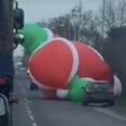 Gigantic inflatable Santa goes rogue and holds up traffic