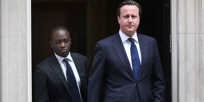 LONDON, UNITED KINGDOM - APRIL 10: Prime Minister David Cameron (R) leaves Downing Street with his Parliamentary Private Secretary Sam Gyimah on April 10, 2013 in London, England. Parliament has been recalled today to allow MPs and Peers to pay their respects to former Prime Minister Lady Thatcher who died on April 8, 2013. (Photo by Peter Macdiarmid/Getty Images)