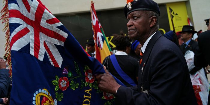 LONDON, ENGLAND - JUNE 22: Flag bearers wait ahead of the unveiling of a memorial honoring the two million African and Caribbean military servicemen and women who served in World War I and World War II, is unveiled in Windrush Square on June 22, 2017 in London, England. The event was attended by war veterans, in-service men and women and dignitaries including the Mayor of London Sadiq Khan, Chiefs of Defence Staff from Caribbean and African countries, High Commissioners from Commonwealth Nations, ambassadors and the Secretary of State for Defence Sir Michael Fallon. (Photo by Dan Kitwood/Getty Images)