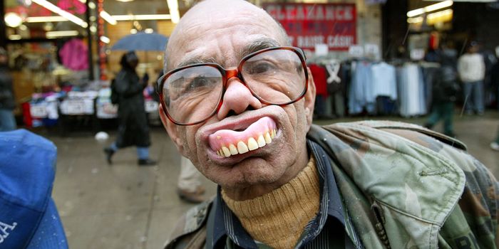 NEW YORK - JANUARY 6: Israel de Jesus shows off his false teeth while watching the 26th Annual Three Kings Day Parade January 6, 2003 in New York City. The parade celebrates the Feast of the Epiphany, also known as Three Kings Day, marking the Biblical story of the visit of three kings to Bethlehem to visit the baby Jesus. (Photo by Mario Tama/Getty Images)