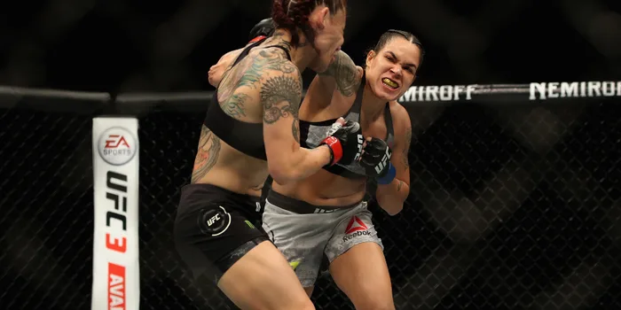 INGLEWOOD, CA - DECEMBER 29: Cris Cyborg of Brazil (left) is punched by Amanda Nunes (right) during a Women's Feather weight bout during the UFC 232 event inside The Forum on December 29, 2018 in Inglewood, California. (Photo by Sean M. Haffey/Getty Images)
