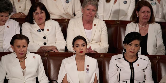 WASHINGTON, DC - FEBRUARY 05: Rep. Alexandria Ocasio-Cortez (D-NY) watches President Donald Trump's State of the Union address in the chamber of the U.S. House of Representatives at the U.S. Capitol Building on February 5, 2019 in Washington, DC. A group of female Democratic lawmakers chose to wear white to the speech in solidarity with women and a nod to the suffragette movement. (Photo by Alex Wong/Getty Images)