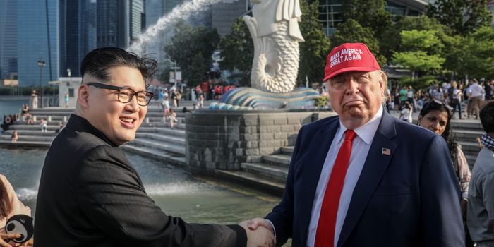 SINGAPORE - JUNE 08: Kim Jong Un impersonator, Howard X (L) and Donald Trump impersonator Dennis Alan (R) pose for photographers during a visit to the famous Merlion Park on June 8, 2018 in Singapore. The historic meeting between U.S. President Donald Trump and North Korean leader Kim Jong-un has been scheduled in Singapore for June 12 as a small circle of experts have already been involved in talks towards the landmark summit in the city-state. (Photo by Chris McGrath/Getty Images)