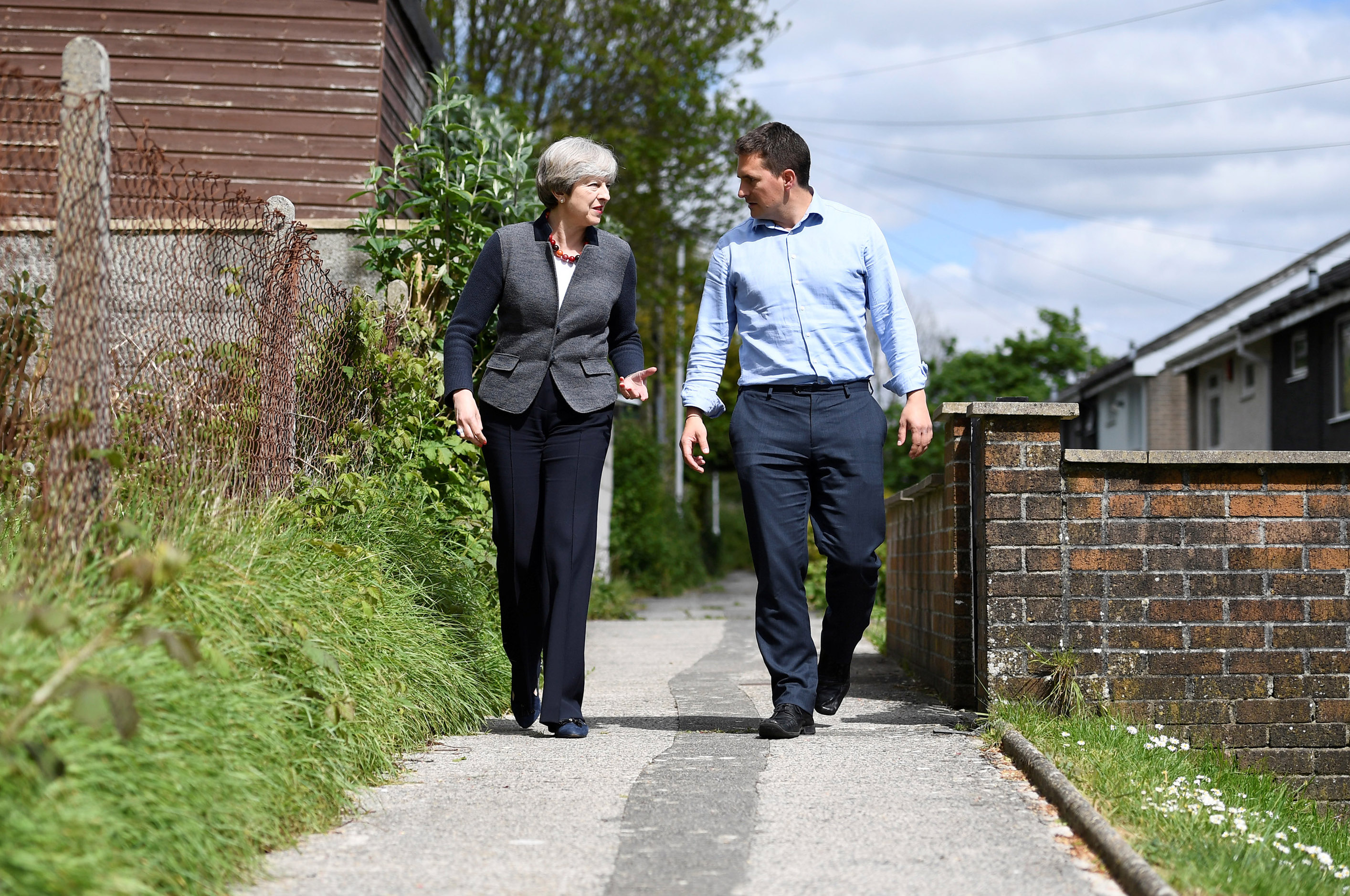 PLYMOUTH, UNITED KINGDOM - MAY 2: Britain's Prime Minister Theresa May walks with local Conservative Party candidate Johnny Mercer during a campaign visit on May 2, 2017 in Plymouth, England. The Prime Minister is campaigning in South-West England, a former Liberal Democrat stronghold, as she urges West Country voters to stick with her party ahead of the polls on June 8. (Photo by Dylan Martinez/WPA Pool/Getty Images)