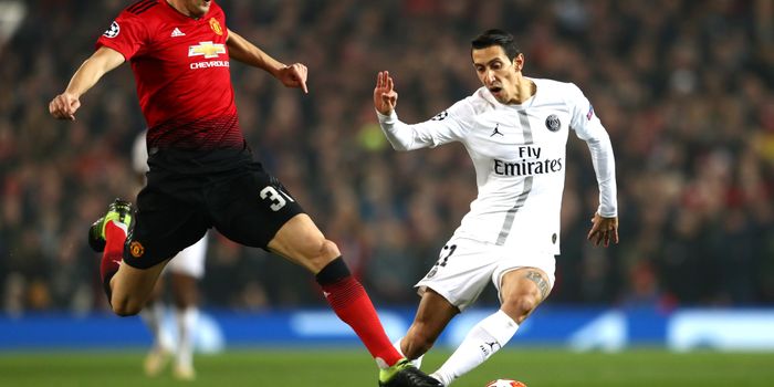 MANCHESTER, ENGLAND - FEBRUARY 12: Angel Di Maria of PSG is tackled by Nemanja Matic of Manchester United during the UEFA Champions League Round of 16 First Leg match between Manchester United and Paris Saint-Germain at Old Trafford on February 12, 2019 in Manchester, England. (Photo by Michael Steele/Getty Images)
