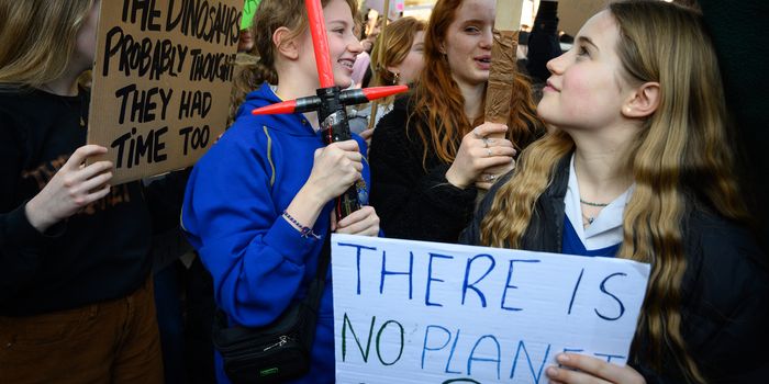 LONDON, UNITED KINGDOM - FEBRUARY 15: A student uses a Star Wars lightsaber toy to hold her placard during a climate protest in Parliament Square on February 15, 2019 in London, United Kingdom. Thousands of UK pupils from schools, colleges and universities will walk out today for a nationwide climate change strike. Students in 60 cities from the West Country to Scotland are protesting, urging the government to declare a climate emergency and take action over the problem. They are keen that the national curriculum is reformed and the environmental crisis is communicated to the public. Similar strikes have taken place in Australia and in European countries such as Belgium and Sweden. (Photo by Leon Neal/Getty Images)