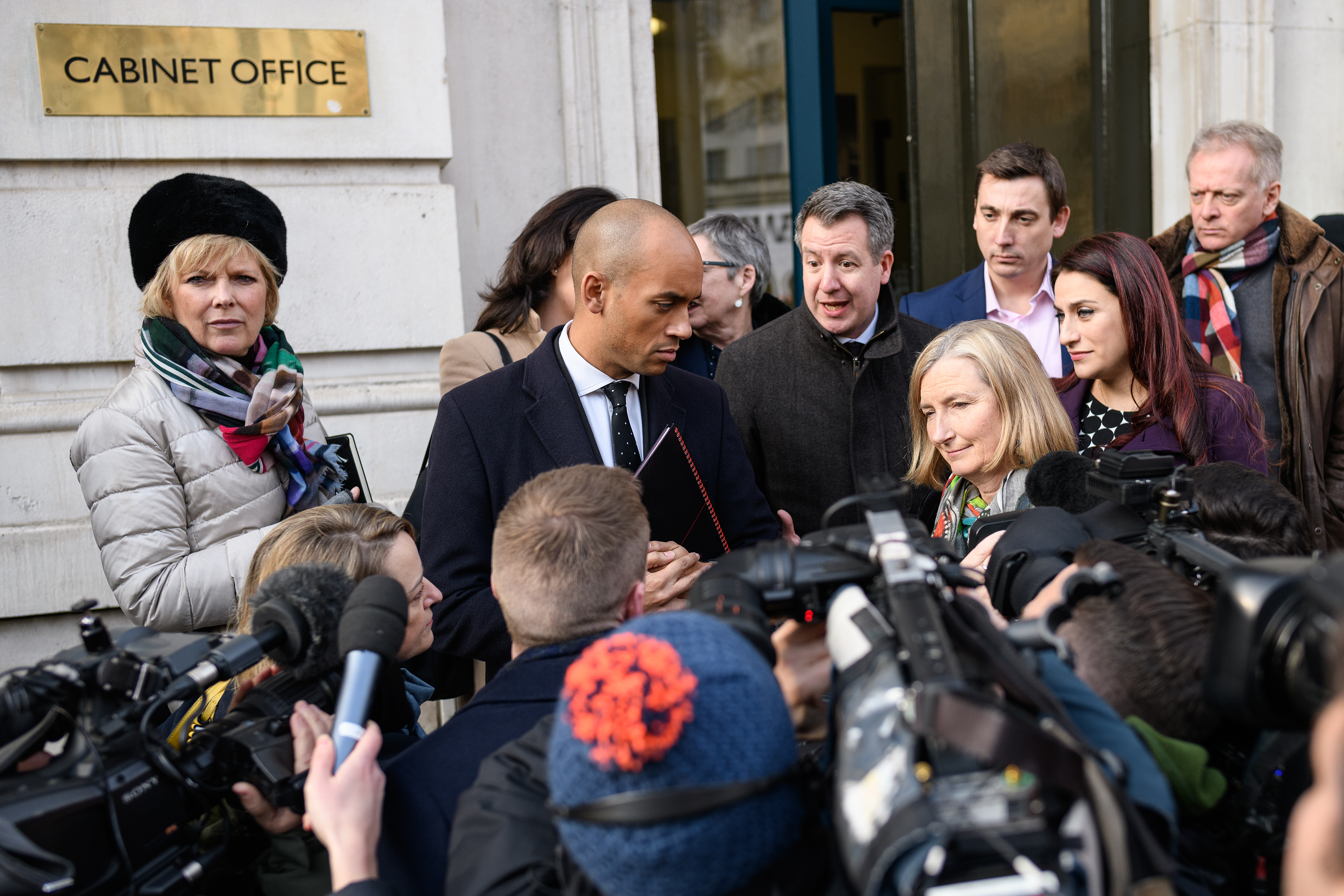 LONDON, ENGLAND - JANUARY 21: Conservative MP Anna Soubry (L), Labour MP Chuka Umunna (2L), Labour MP Chris Leslie (3L), Conservative MP Sarah Wollaston (3R), Labour MP Gavin Shuker (3R), Labour MP Luciana Berger (2R) and Conservative MP Phillip Lee (R) speak with the media outside the Cabinet Office following a Brexit meeting with Theresa May's Chief of Staff Gavin Barwell and David Liddington MP on January 21, 2019 in London, England. British Prime Minister Theresa May is set to attempt to convince Conservative Brexiteers and DUP MPs to back her current withdrawal deal by resolving Irish backstop concerns. Her attempts to reach a cross-party agreement last week were thwarted after the Labour Party leader Jeremy Corbyn insisted on the removal of leaving the European Union with "no deal" as an option in the negotations on how to proceed with Brexit, before he would talk to the Government. (Photo by Leon Neal/Getty Images)
