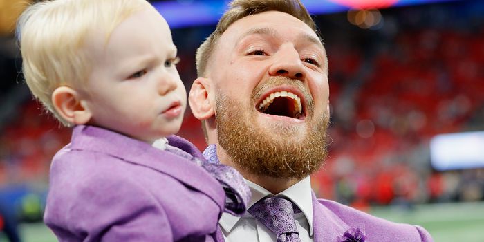 ATLANTA, GA - FEBRUARY 03: Conor McGregor with his son, Conor Jack McGregor Jr., on the field prior to Super Bowl LIII at Mercedes-Benz Stadium on February 3, 2019 in Atlanta, Georgia. (Photo by Kevin C. Cox/Getty Images)