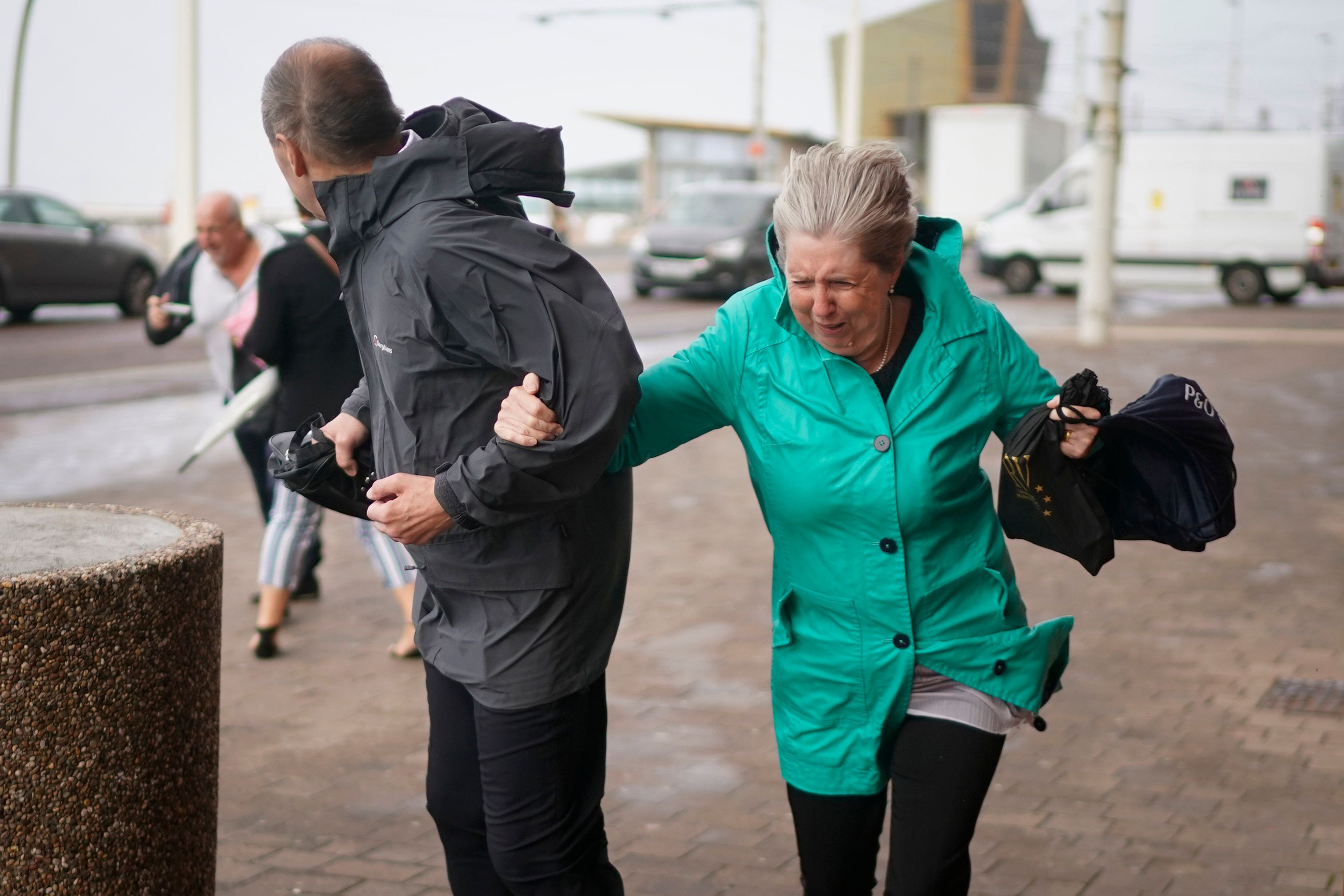 BLACKPOOL, ENGLAND - SEPTEMBER 19: Members of the public struggle in the wind as Storm Ali hits land on September 19, 2018 in Blackpool, England. Severe gales which are set to get up to as much as 80mph are causing road, rail and ferry travel disruption as Storm Ali hits parts of the United Kigndom. (Photo by Christopher Furlong/Getty Images)