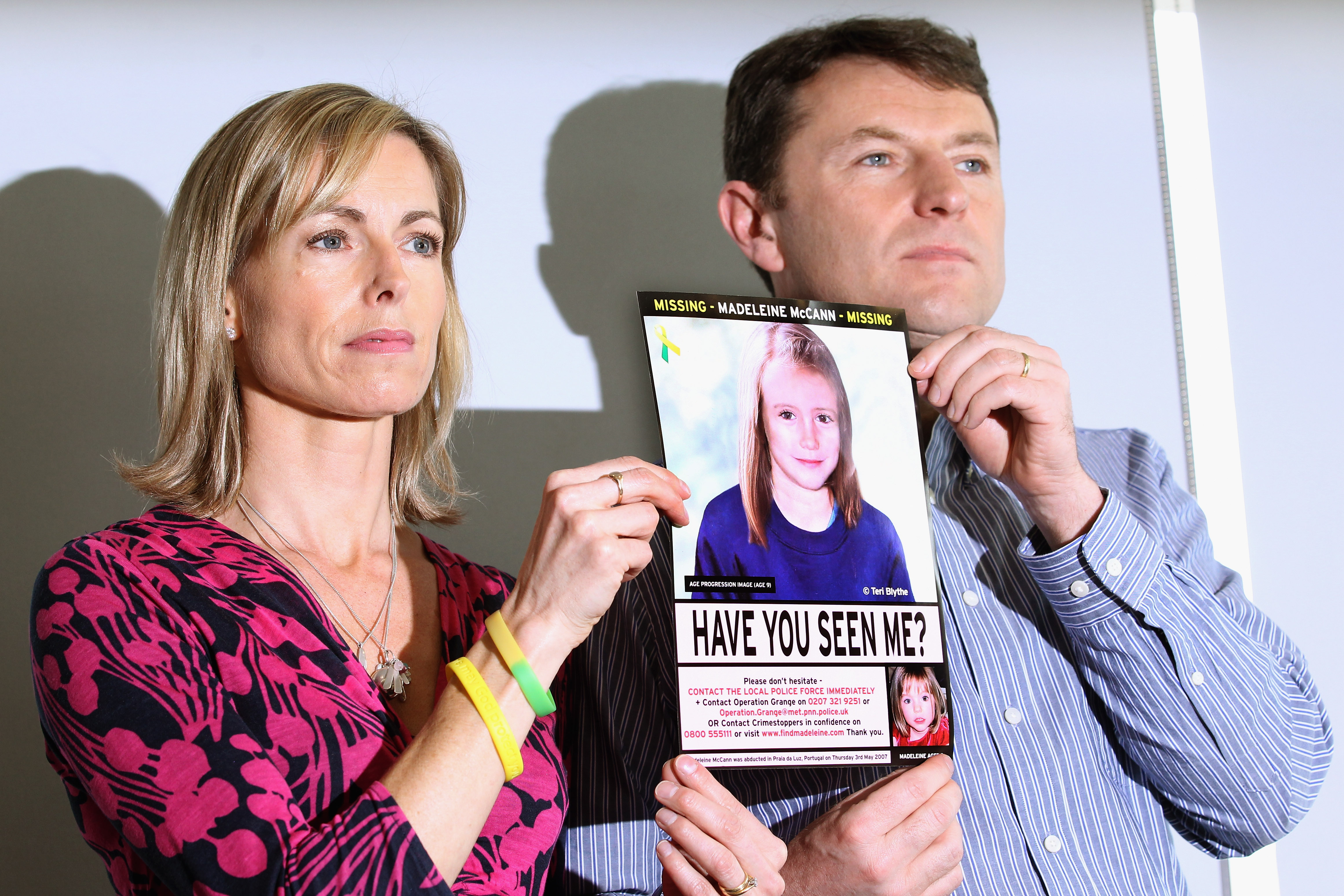 LONDON, ENGLAND - MAY 02:  Kate and Gerry McCann hold an age-progressed police image of their daughter during a news conference to mark the 5th anniversary of the disappearance of Madeleine McCann, on May 2, 2012 in London, England. The McCann's today stated that there is "no doubt" that authorities will re-open the investigation into their daughter's disappearance. Three-year-old Madeleine went missing while on holiday with her parents in the Algarve region of Portugal in May 2007.  (Photo by Dan Kitwood/Getty Images)