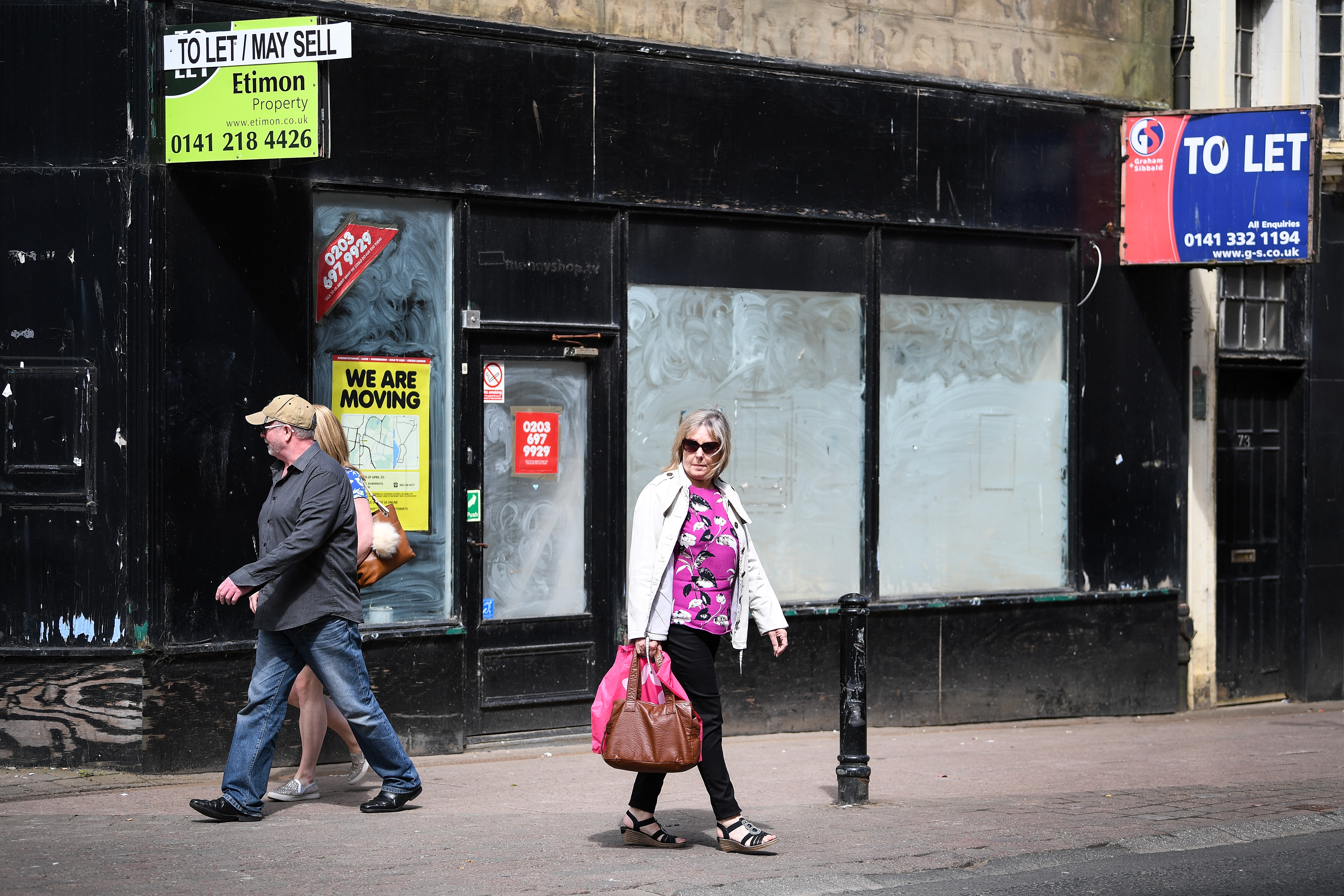 AYR, SCOTLAND - JUNE 05:  Members of the public walk past closed down shops on June 5, 2018 in Ayr, Scotland. Recent research shows that highstreets in Scotland have suffered the largest reduction in the number of occupied shops anywhere in the UK.  (Photo by Jeff J Mitchell/Getty Images)