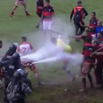 Brazilian football match descends into mass brawl as police use pepper spray to disperse crowd