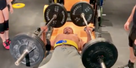 Powerlifter Larry Wheels bench presses with a staggering 110kg barbell in each hand