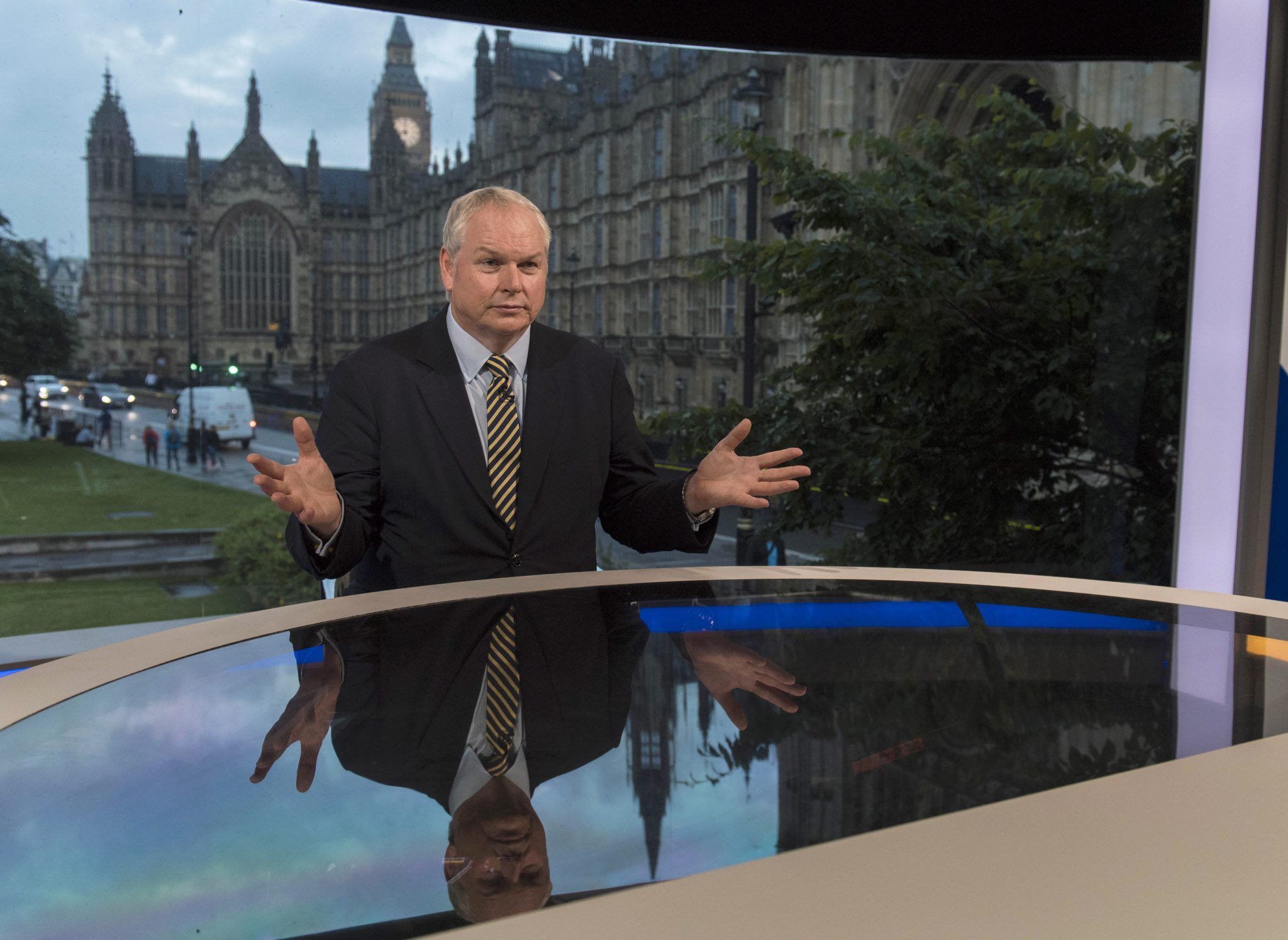 In this handout image provided by Sky News, Adam Boulton prepares to deliver the referendum results on June 23, 2016 in London, England. (Photo by Chris Lobina/Sky News via Getty Images)