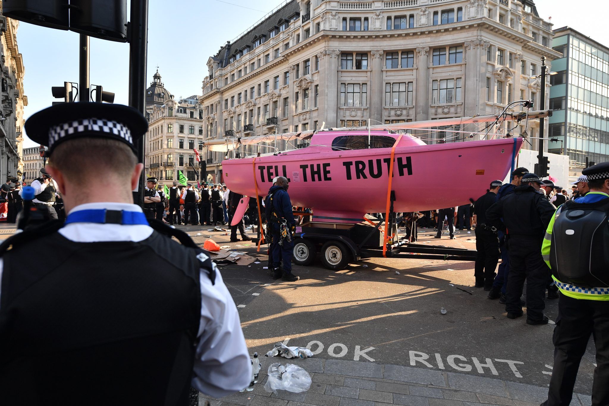 Police officers continue to clear Oxford Circus of protesters and dismantle a pink ship that formed the centerpiece of the demonstrations during the fifth day of a coordinated protest by the Extinction Rebellion group on April 19, 2019 in London, England. The environmental campaign group has blocked a number of key junctions in central London and have threatened to disrupt Heathrow airport, in a bid to highlight the ongoing ecological crisis. (Photo by Leon Neal/Getty Images)