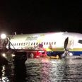 Boeing 737 skids into river after attempting to land during thunderstorm
