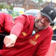 WATCH: Jurgen Klopp almost falls off bus during Liverpool’s trophy parade