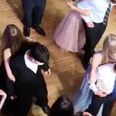 Teens dance back-to-back at prom to maintain social distancing