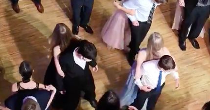 Teens dance back-to-back at prom to maintain social distancing