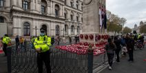 Extinction Rebellion place climate change banner on Cenotaph on Remembrance Day
