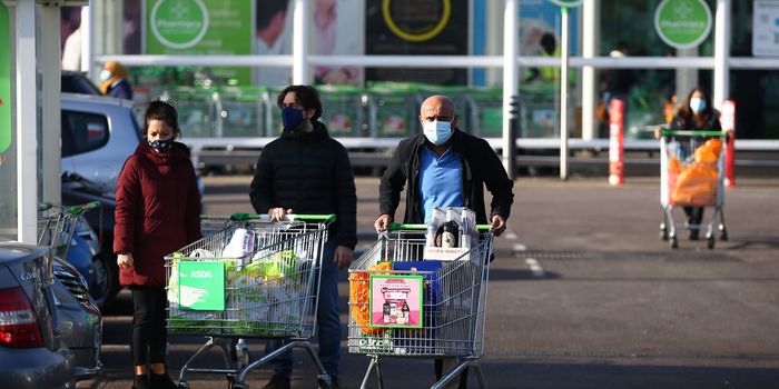 Shoppers at Asda wearing masks during the coronavirus pandemic, workers at the supermarket will get Boxing Day off