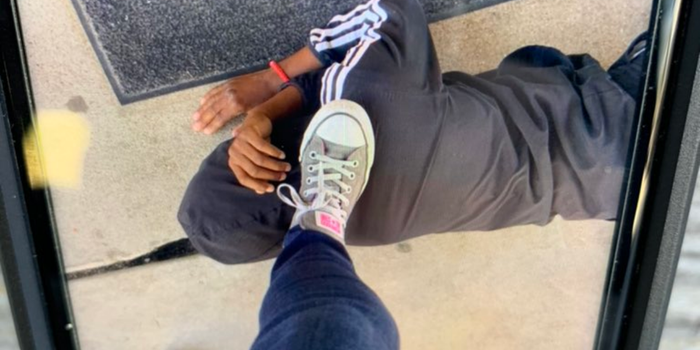 Teacher resigns after placing foot on Black student's neck