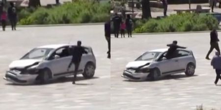 Man drop kicks through car window to save crowd from dangerous driver