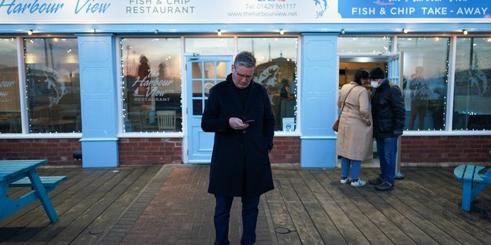 Keir Starmer stounds outside a fish and chip shop in Hartlepool while ccampaigning for the Labour party ahead of the upcoming by-election